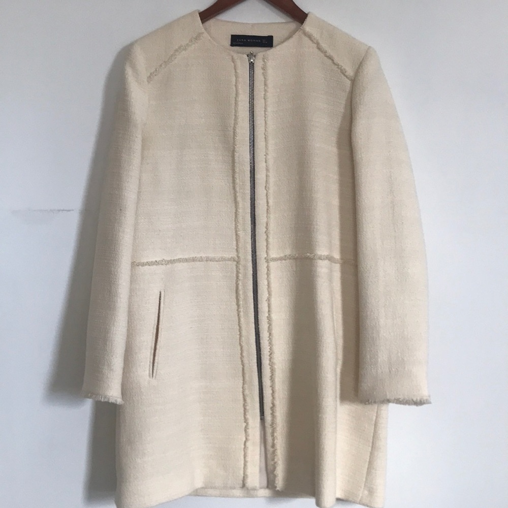 Beige coat.